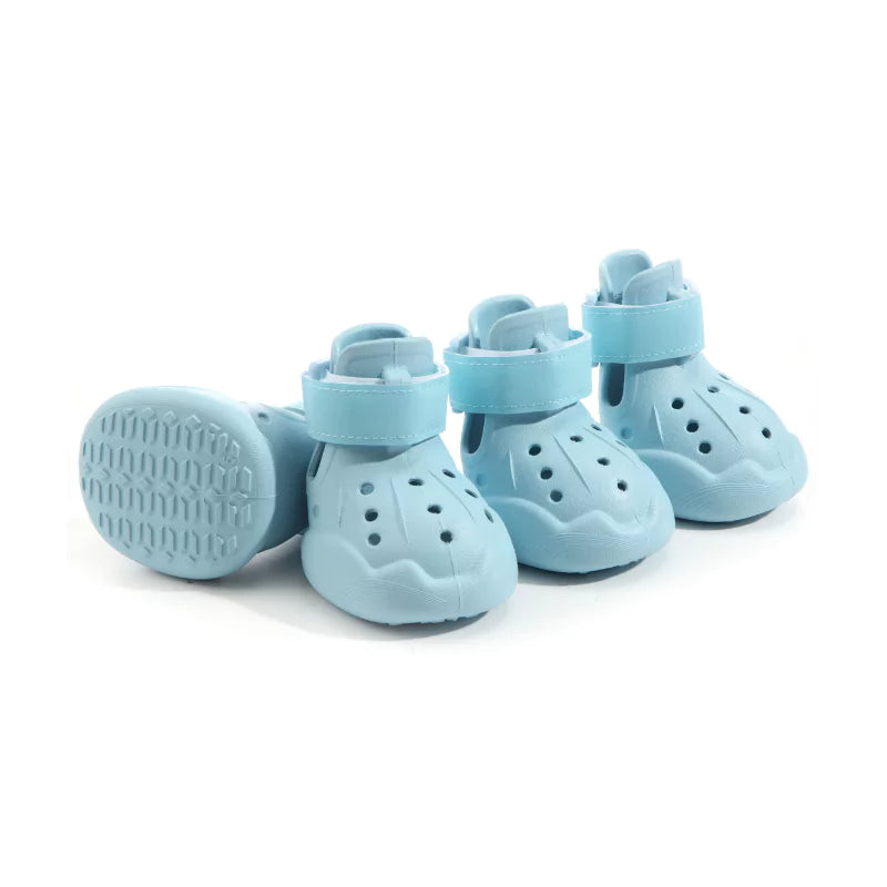 Light blue pet shoes on a white background