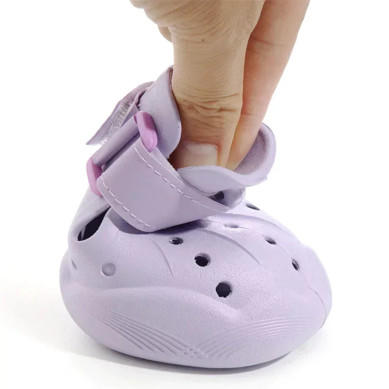 Purple sandal with a strap on a white background
